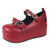 Red Winged Heart Mary Jane on white, showing the rounded toe, decorative bat wings and tall red platform profile.