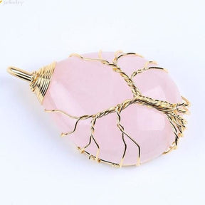 Rose quartz teardrop pendant with gold-tone branches and a twisted wire trunk.