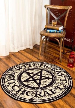 Vertical room view showing the round witchcraft rug as a floor accent beside furniture.