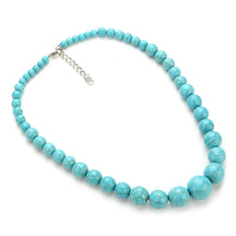 Turquoise-coloured choker with graduated round beads, dark veining and silver-tone fastening hardware on white.