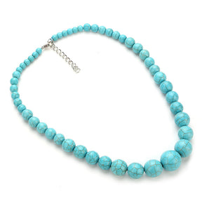 Turquoise-coloured choker with graduated round beads, dark veining and silver-tone fastening hardware on white.