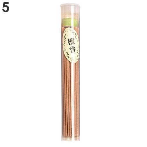 Brown sandalwood incense sticks in a clear capped tube with a light green and white fragrance label.