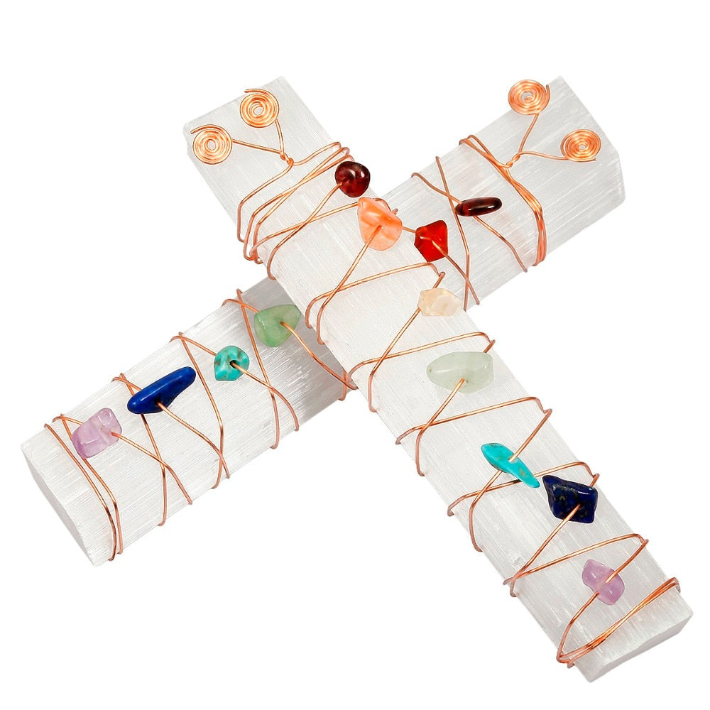 Two white selenite wands crossed on white, each wrapped with copper wire and a line of colourful irregular crystal accents.