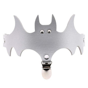 Silver-coloured bat garter with a matching leg band and a clip below the winged centre.