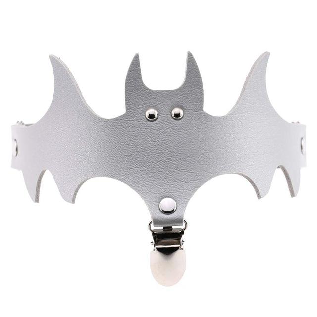 Silver-coloured bat garter with a matching leg band and a clip below the winged centre.