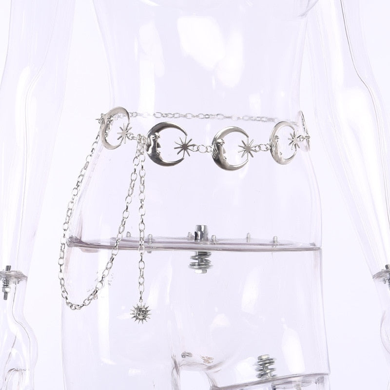Angled clear-mannequin view of the linked crescent moon belt and its dangling starburst charm.