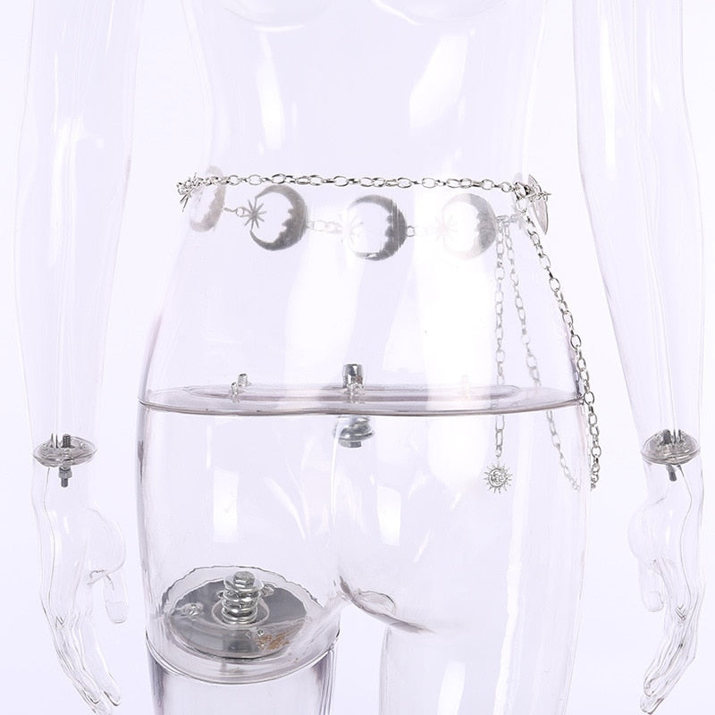 Rear-side view of the celestial chain belt on a clear mannequin, showing the moon links continuing around the waist.