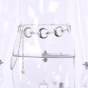 Front view of the silver-tone moon-and-star belt on a clear mannequin, with the adjustable chain draped to one side.