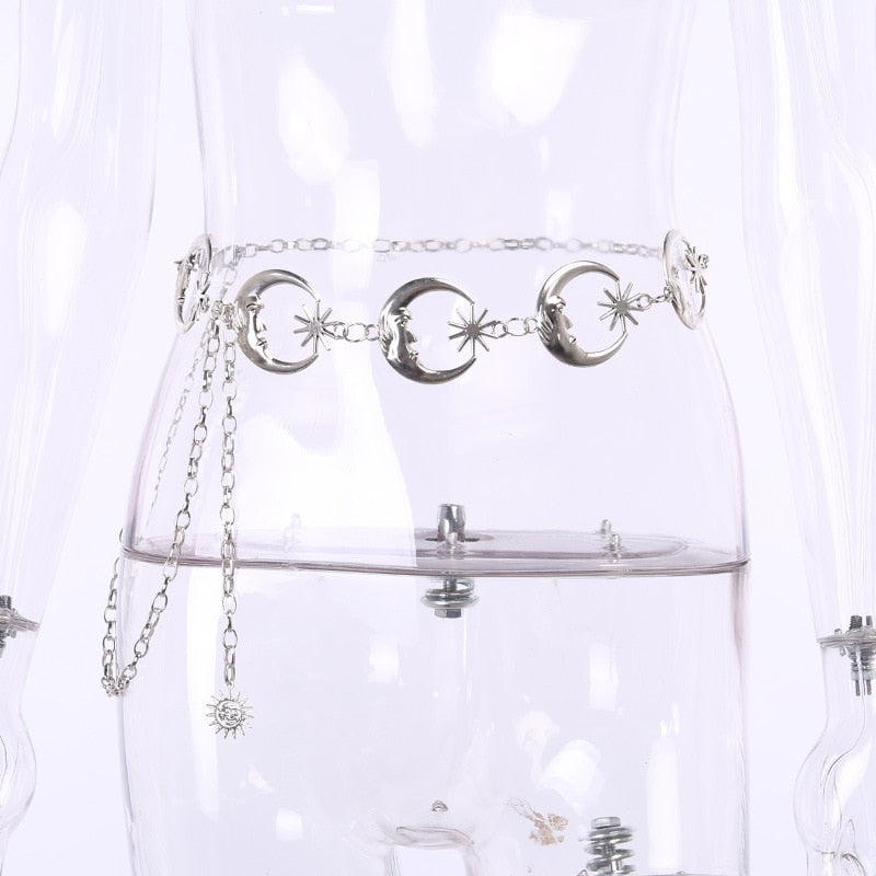 Front view of the silver-tone moon-and-star belt on a clear mannequin, with the adjustable chain draped to one side.