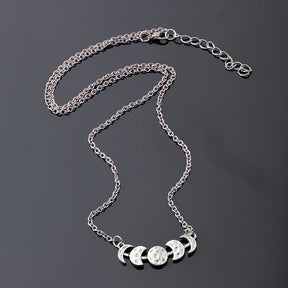 Silver-tone moon phase necklace showing the chain, lobster clasp and extender.