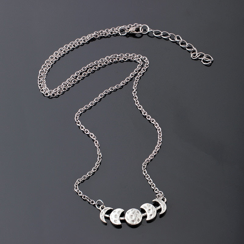 Silver-tone moon phase necklace showing the chain, lobster clasp and extender.