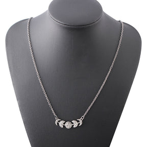 Silver-tone moon phase necklace shown with the full chain on a necklace display bust.