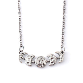 Silver-tone moon phase necklace with a closer view of the textured lunar centerpiece on white.