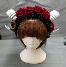 Demon horn headband with silver-tone curled horns and red roses.