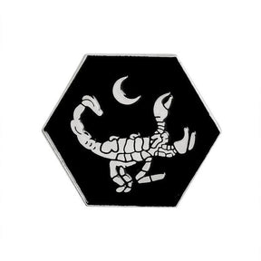Silver-tone scorpion pin on white, with outlined claws and a curled tail; this design is not a current selectable option.