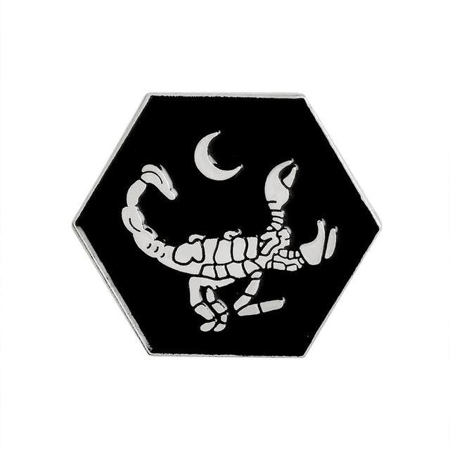 Silver-tone scorpion pin on white, with outlined claws and a curled tail; this design is not a current selectable option.