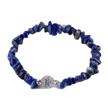 Deep blue lapis lazuli chip bracelet with small irregular stones and a sparkling round clasp.
