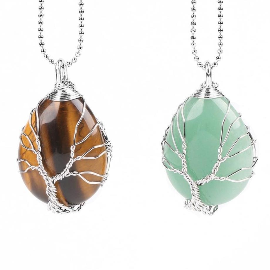 Tiger eye and green aventurine Tree of Life pendants displayed together on silver-tone chains.