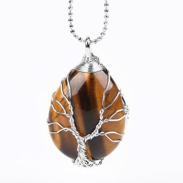 Tiger eye Tree of Life necklace arranged with its silver-tone chain, showing the stone's warm brown bands.