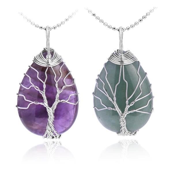 Purple amethyst and green aventurine pendants on silver-tone chains, with branching Tree of Life wirework across the stones.