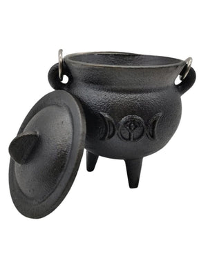 Triple moon cauldron with lid beside bowl