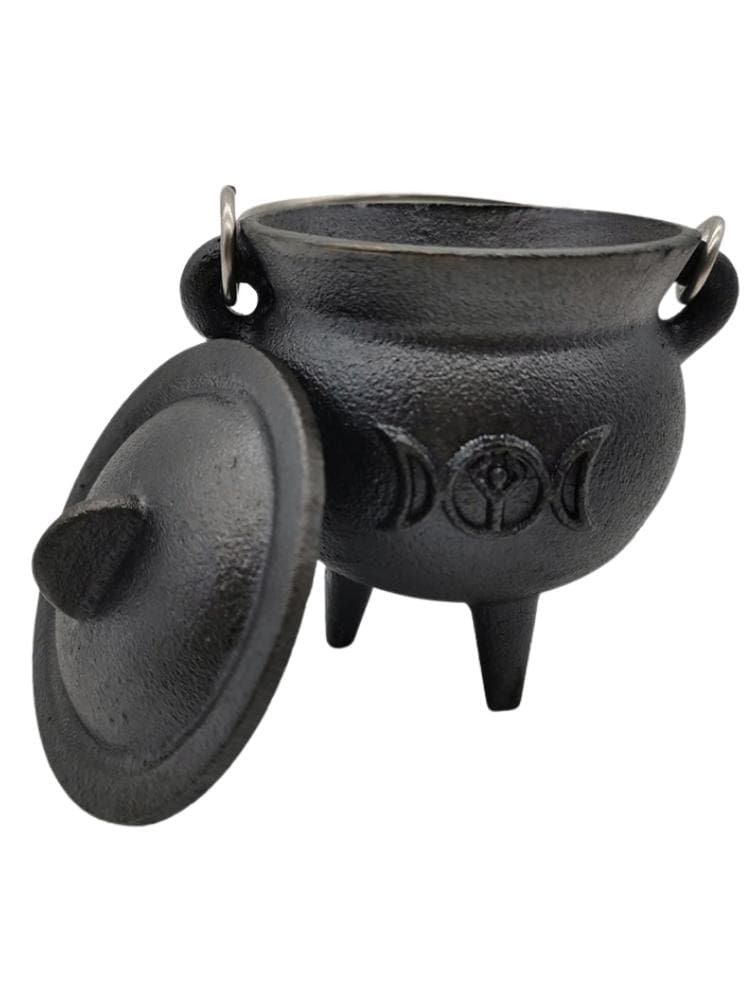Triple moon cauldron with lid beside bowl