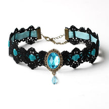 Black lace choker with an ornate oval centerpiece and hanging teardrop in the Turquoise ribbon and jewel option.