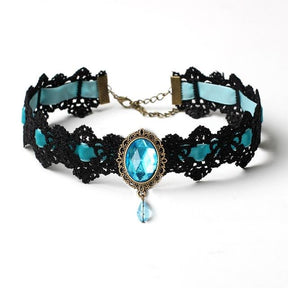 Black lace choker with an ornate oval centerpiece and hanging teardrop in the Turquoise ribbon and jewel option.