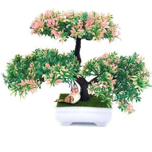 Artificial bonsai with three rounded clusters of pink and green foliage above a dark trunk and a white rectangular footed pot.