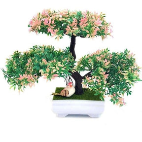 Artificial bonsai with three rounded clusters of pink and green foliage above a dark trunk and a white rectangular footed pot.