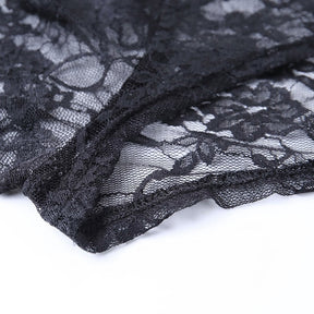 Close view of the overlay's finished black edge against sheer floral lace, showing the narrow trim and transparent net background.
