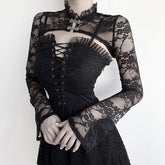 Black Victorian-inspired lace bolero styled over a lace-up black dress, displaying the sheer floral sleeves, cropped front and decorative clasps.