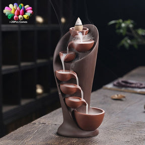 Brown waterfall incense burner with a smoke cascade and an inset graphic indicating 20 included cones.