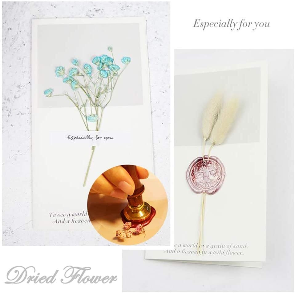 Stationery example with dried flowers and a wax seal, showing a decorative presentation alongside letter-writing accessories.