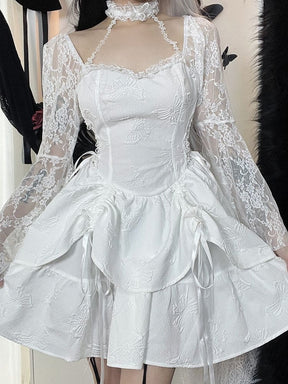 White butterfly-textured mini dress shown from the front with lace sleeves on the shoulders, an attached choker and a softly flared layered skirt.