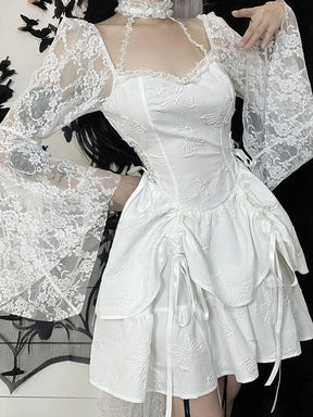 White Dark Chapel dress modeled with a hand near the neckline. The matching lace choker, narrow star-patterned straps and gathered skirt ties are visible.