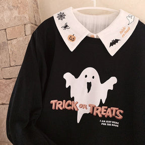 White Halloween collar layered over a black ghost-print sweatshirt on a hanger, with the pumpkin, spiderweb and bat embroidery framing the neckline.