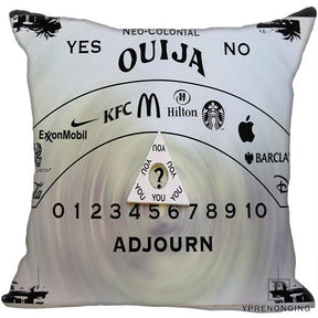 White square cushion cover with a parody spirit-board layout, corporate logo imagery, a central question-mark planchette and black numbers.