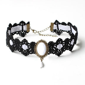 Black lace choker with an ornate oval centerpiece and hanging teardrop in the White ribbon and jewel option.