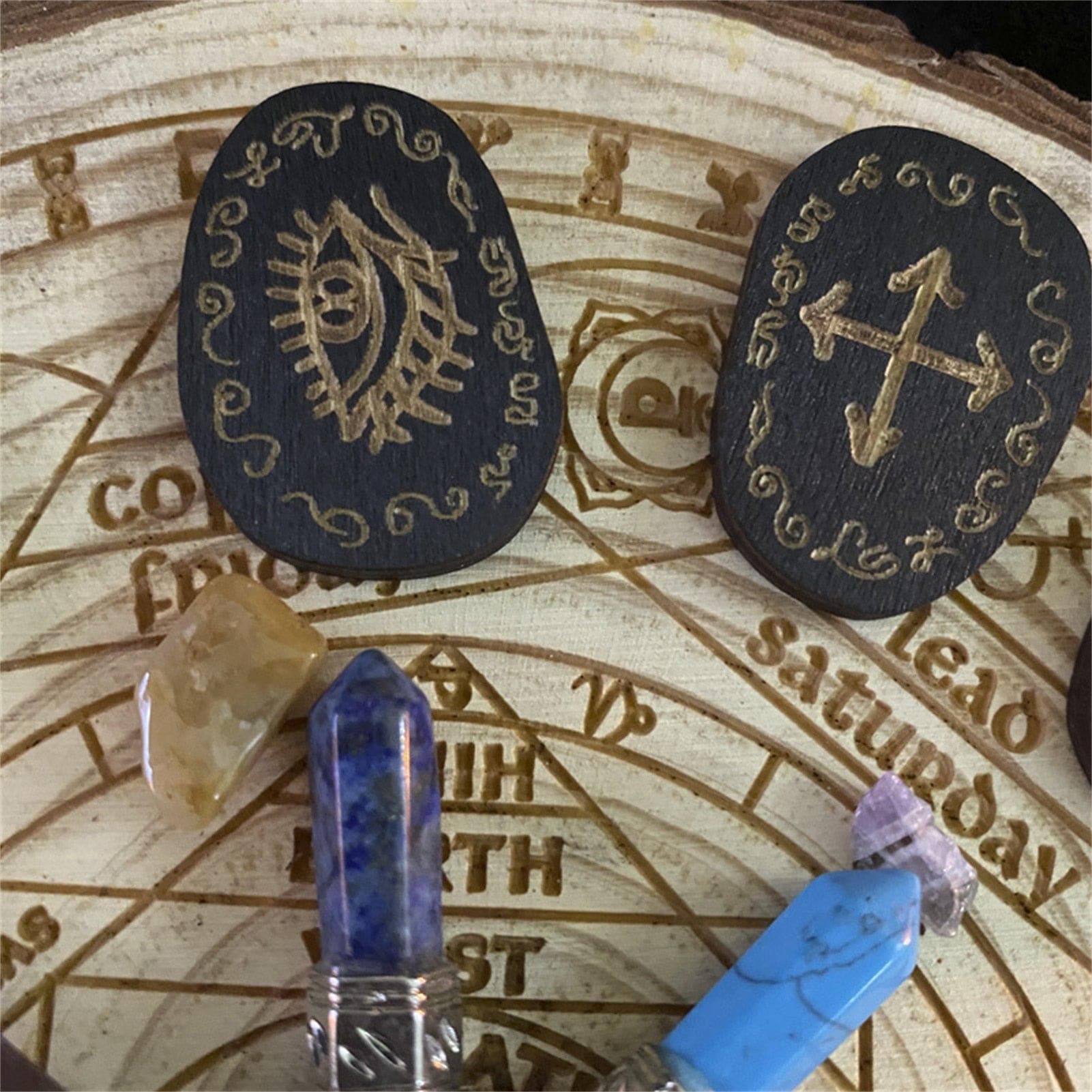 Eye and crossed-symbol rune tile details
