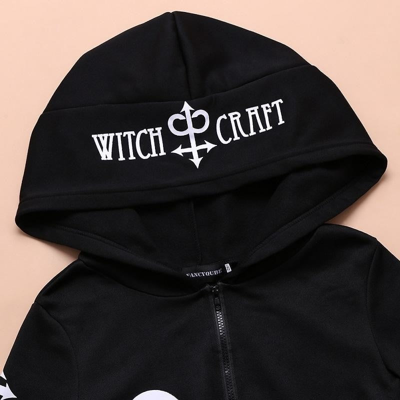 Detail of the black hood with Witch Craft lettering and a white printed symbol.