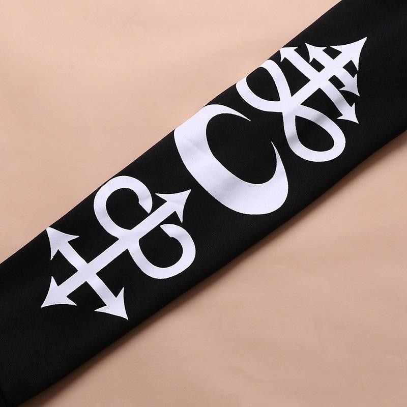 Close-up of large white occult-inspired graphics printed down the black hoodie sleeve.