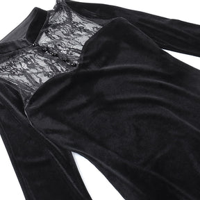 Close view of the gown laid flat, showing the curved velvet bodice edge beneath sheer floral lace.