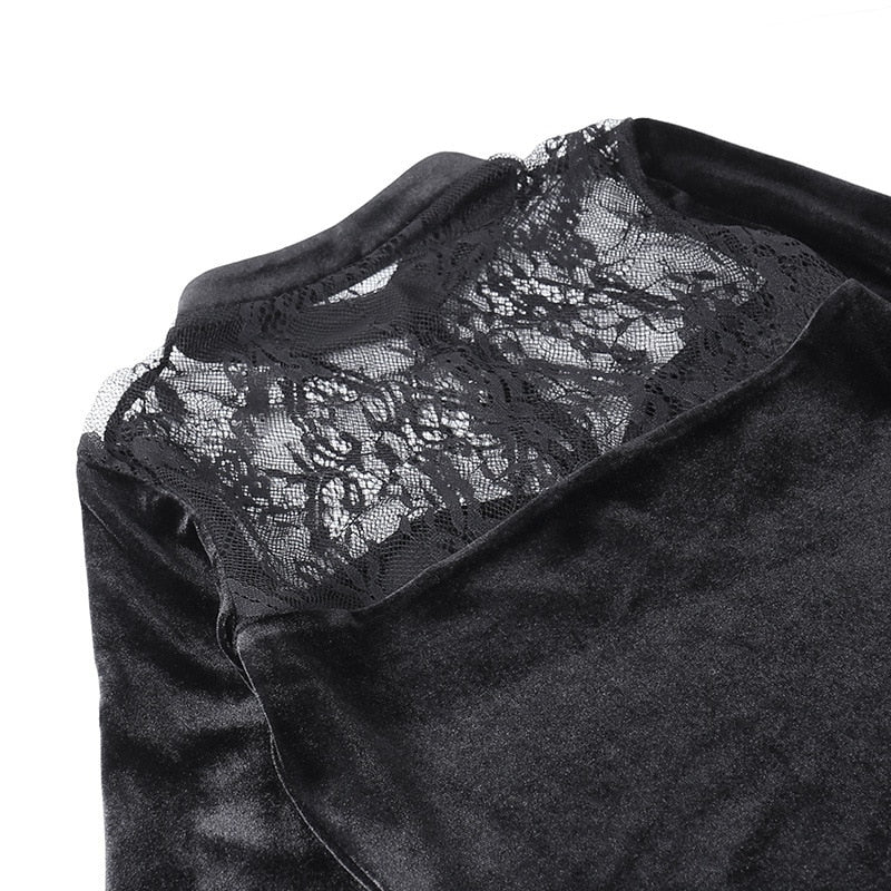 The floral lace yoke laid flat between velvet panels, revealing the branching flower pattern.