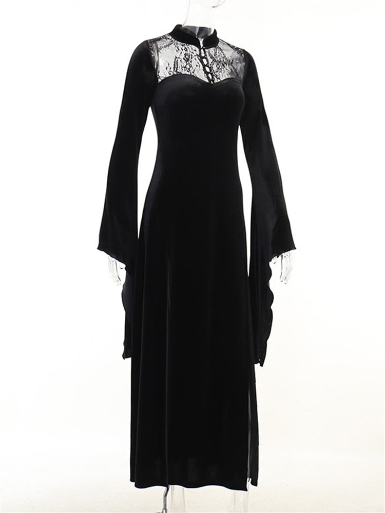 Black velvet gown on an angled mannequin, showing the high collar, lace upper panel and pointed sleeve ends.