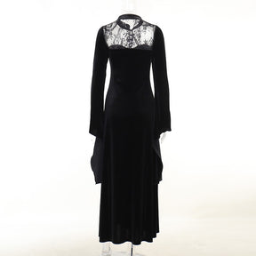Rear mannequin view with sheer lace across the upper back, a high collar and a long black velvet skirt.