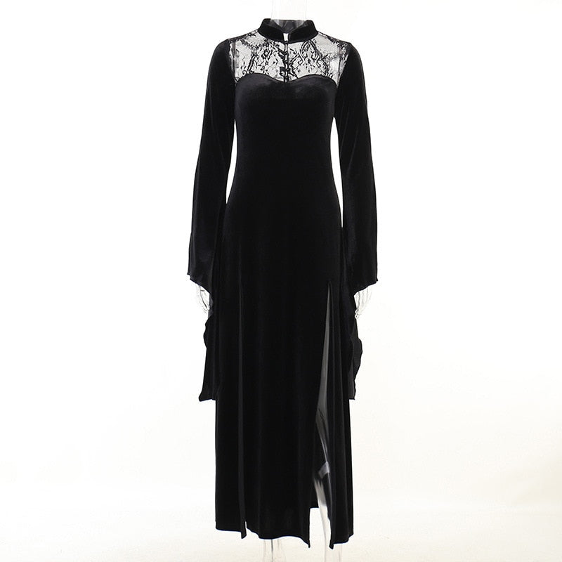 Full-length mannequin view of the gown with sleeve drapes beside the skirt and a sheer floral neckline.