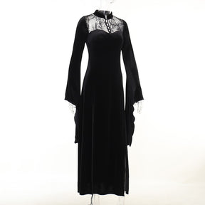 Three-quarter mannequin view showing the black gown's fitted bodice, lace yoke and flowing skirt.