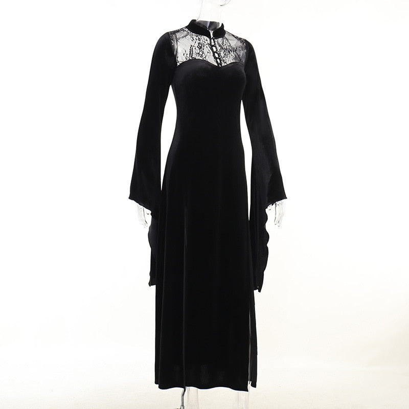 Three-quarter mannequin view showing the black gown's fitted bodice, lace yoke and flowing skirt.