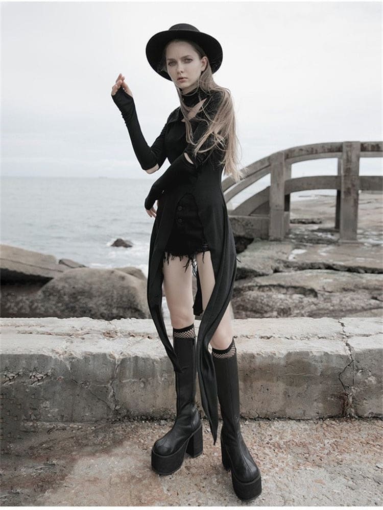 Full view of a black asymmetric layering dress with one hand raised, showing hand-covering sleeves, an elbow cutout and long split hem panels.